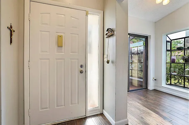 wooden floor with white walls