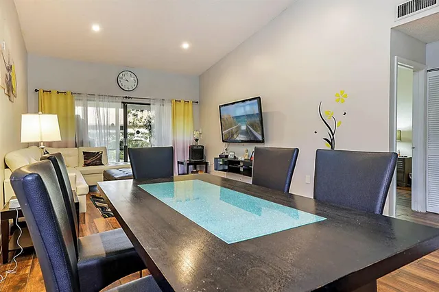 a living room with furniture rug and window