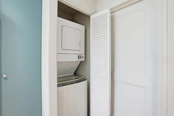 a close view of a utility room with washer and dryer