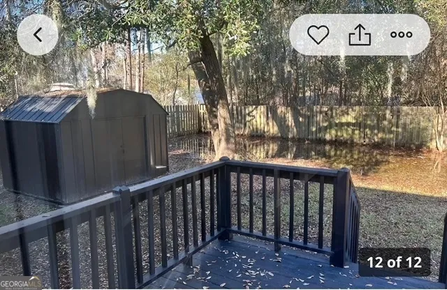 a view of a wooden fence with a sign on the wall