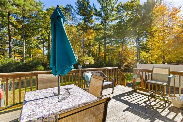 a view of balcony with wooden floor and outdoor seating