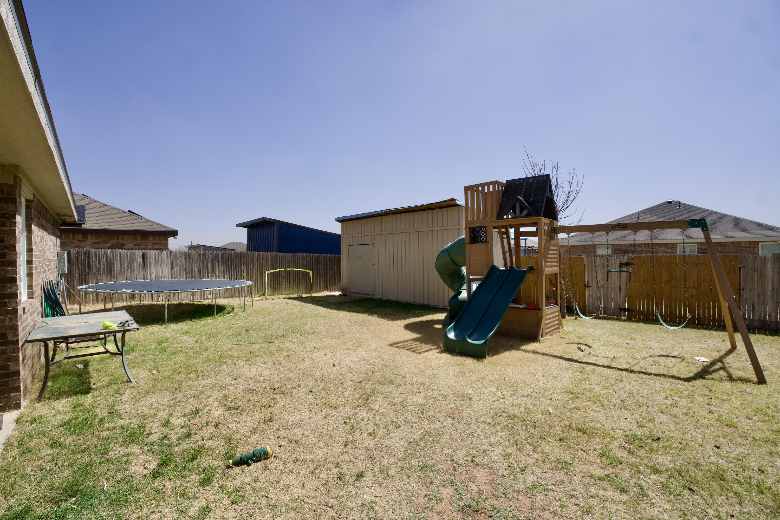 8811 16th Street Lubbock, TX 79416 - Photo 16 of 17 a view of outdoor space and deck