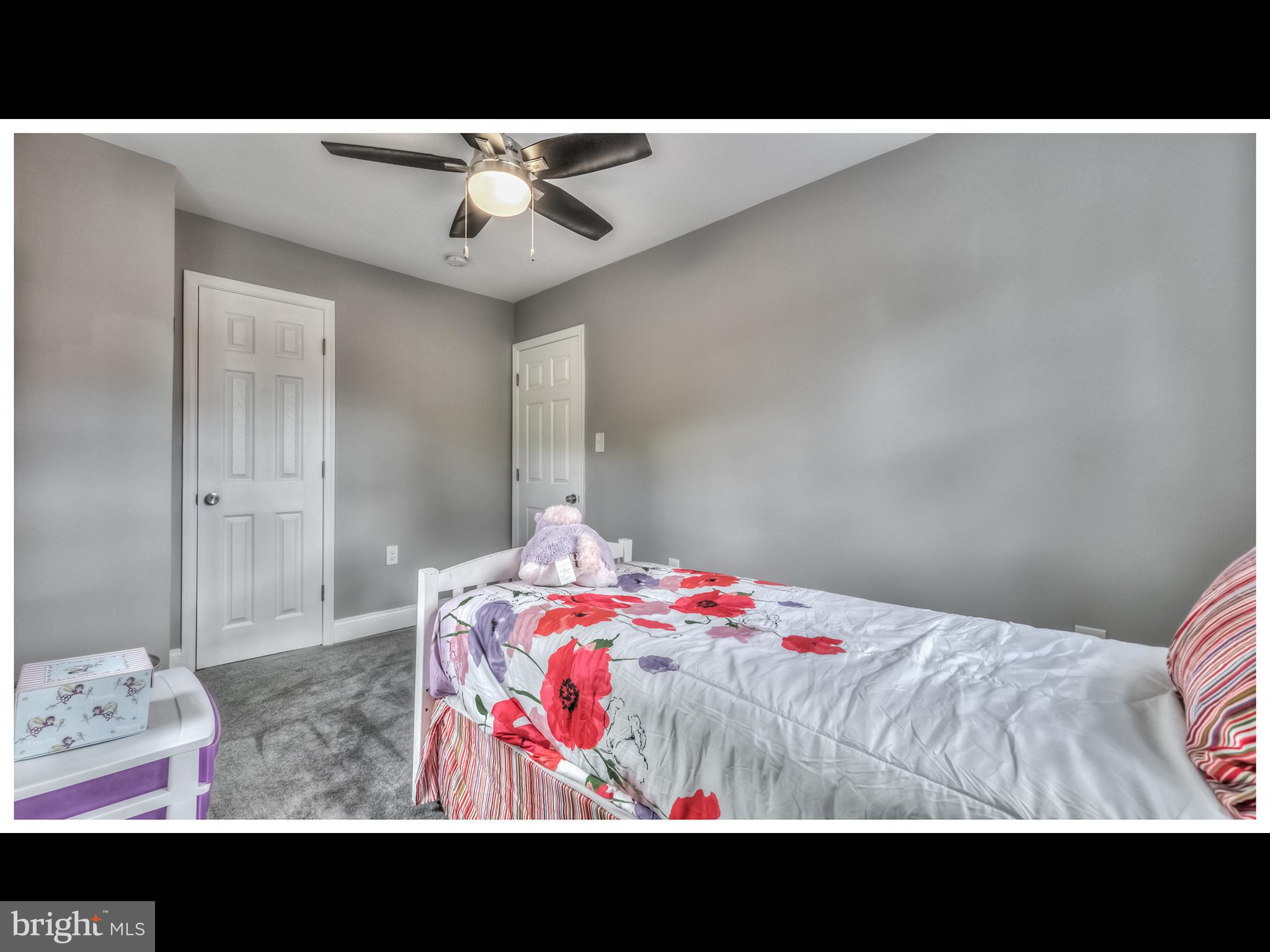 5932 Hillen Road Baltimore, MD 21239 - Photo 14 of 23 a view of bedroom with a bed