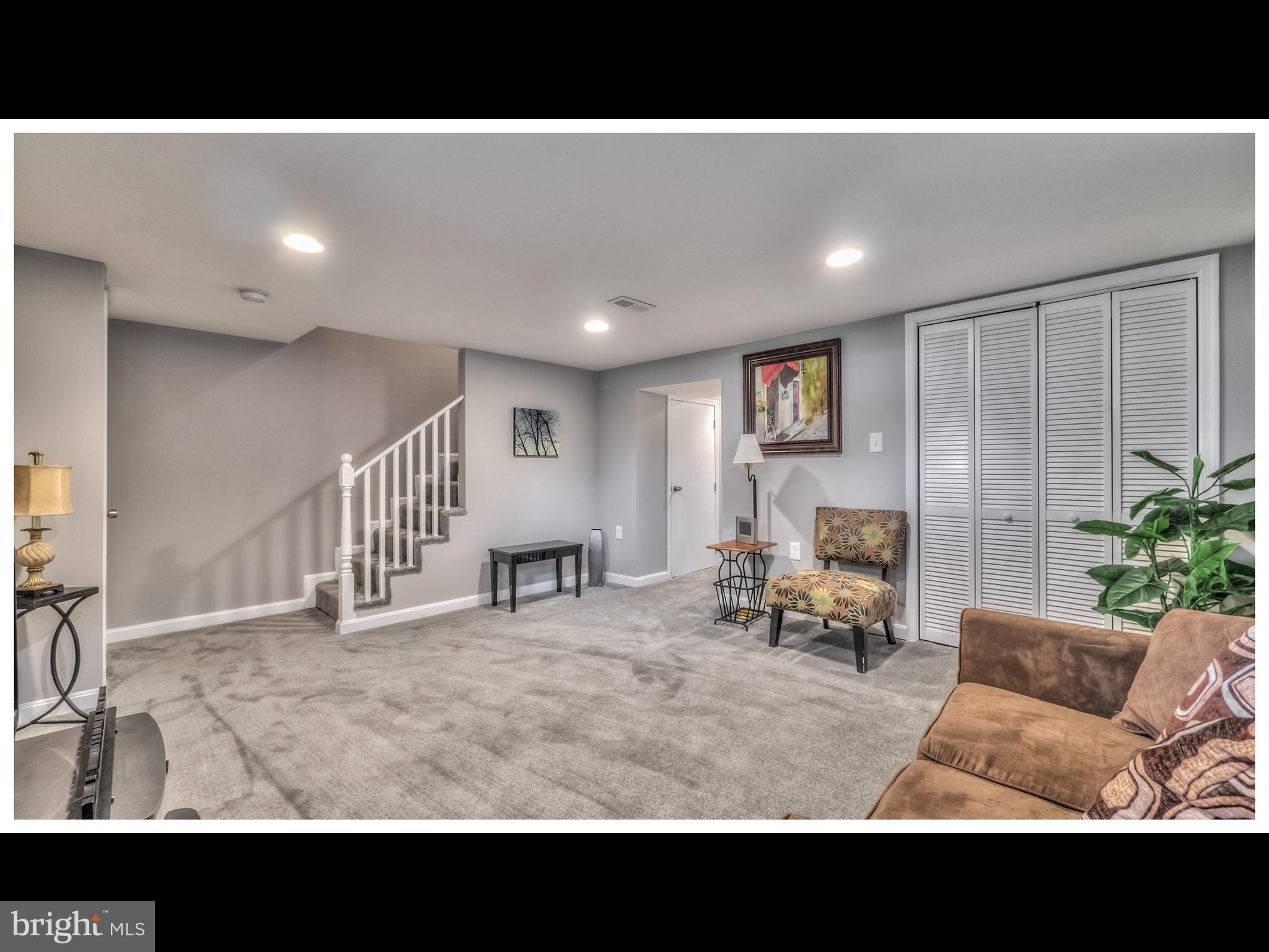 5932 Hillen Road Baltimore, MD 21239 - Photo 18 of 23 a view of a living room and a livingroom with furniture