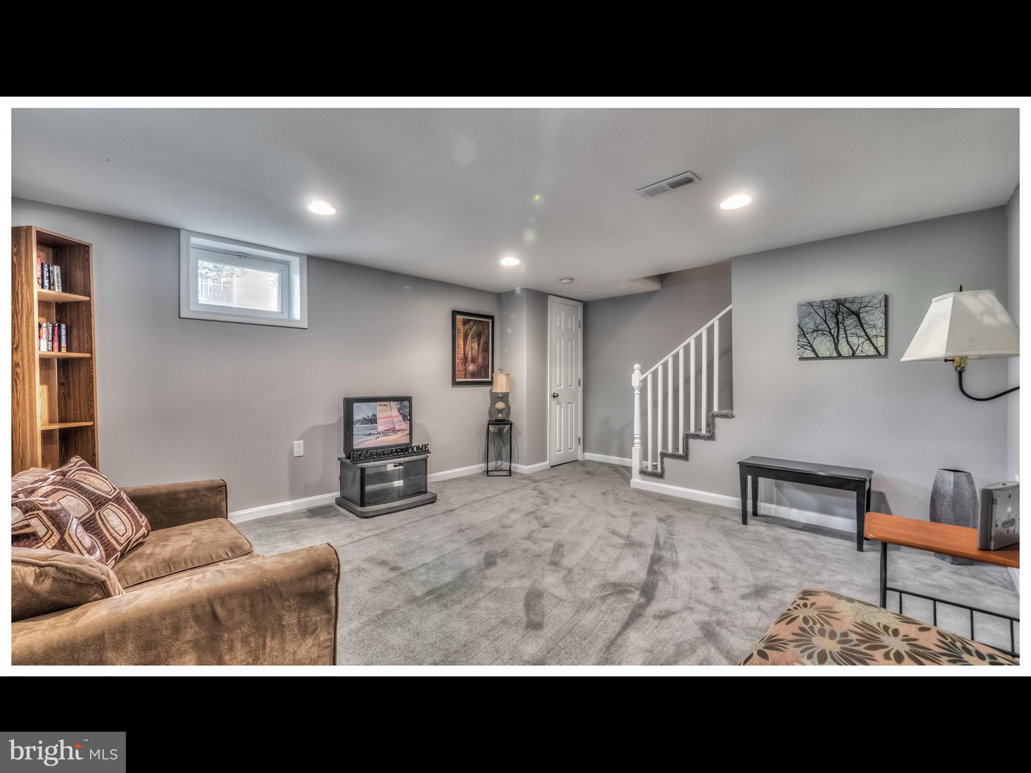 5932 Hillen Road Baltimore, MD 21239 - Photo 19 of 23 a kitchen with furniture and a rug