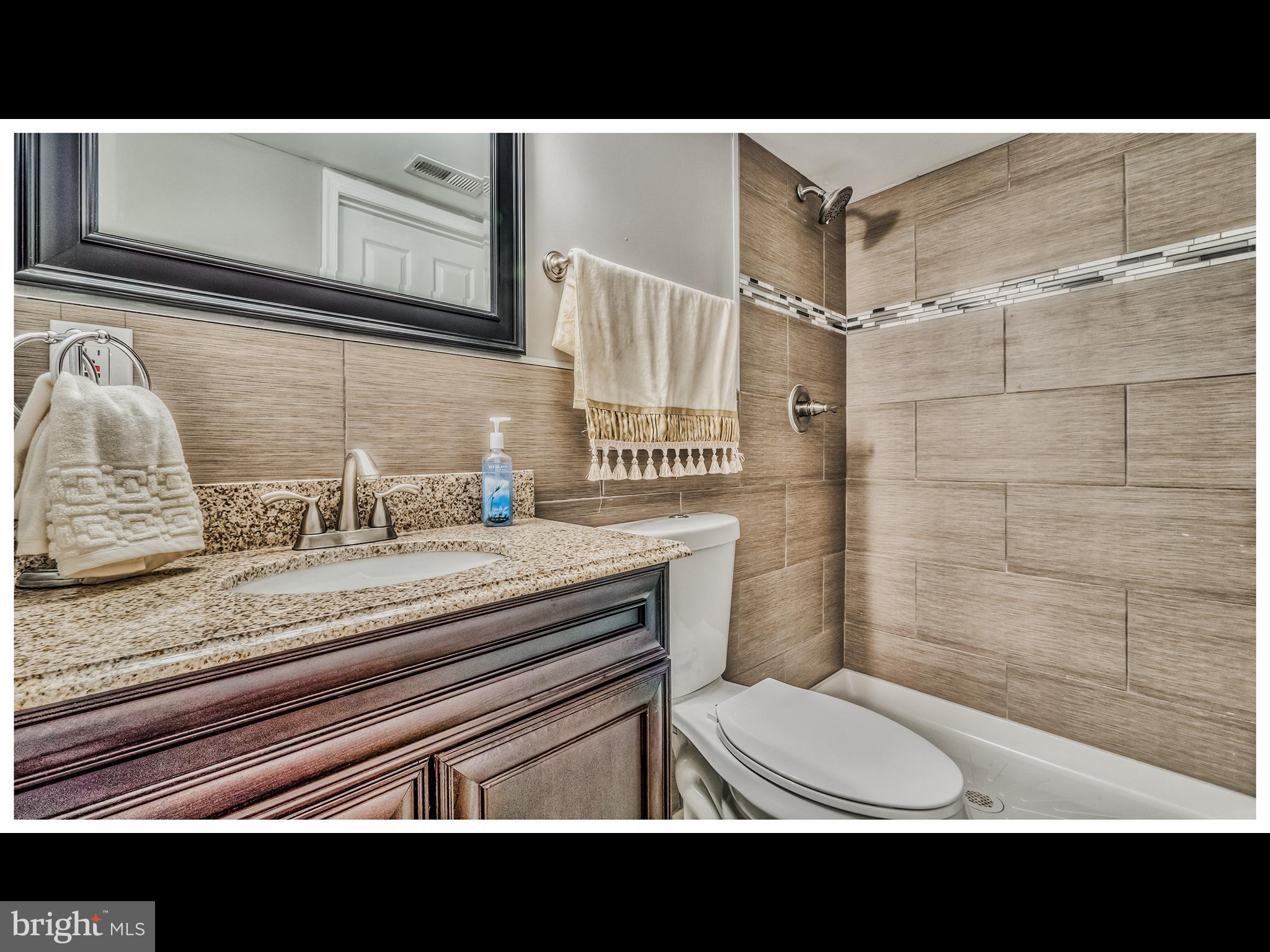 5932 Hillen Road Baltimore, MD 21239 - Photo 20 of 23 a view of a bathroom with a sink and a toilet