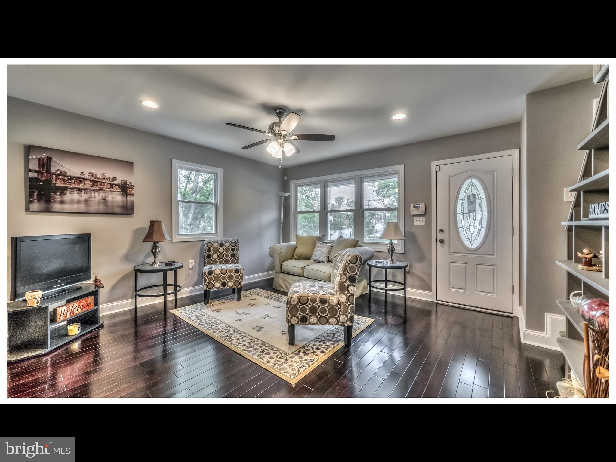 5932 Hillen Road Baltimore, MD 21239 - Photo 6 of 23 a view of living room and dining room