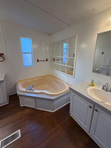 a bathroom with a sink and a bathtub