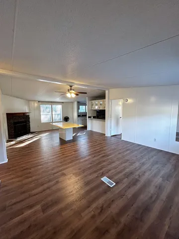 a view of outdoor space with wooden floor and fire place