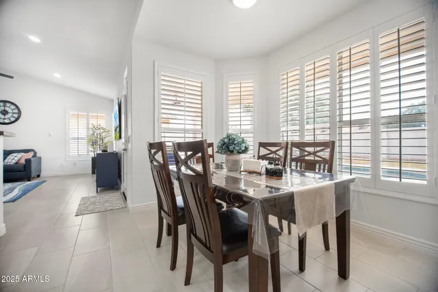 a kitchen with stainless steel appliances a refrigerator sink and cabinets