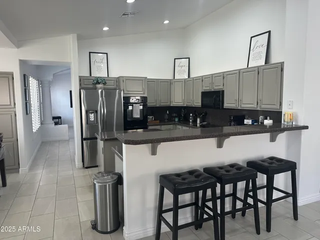 a living room with couch a large window with outer view