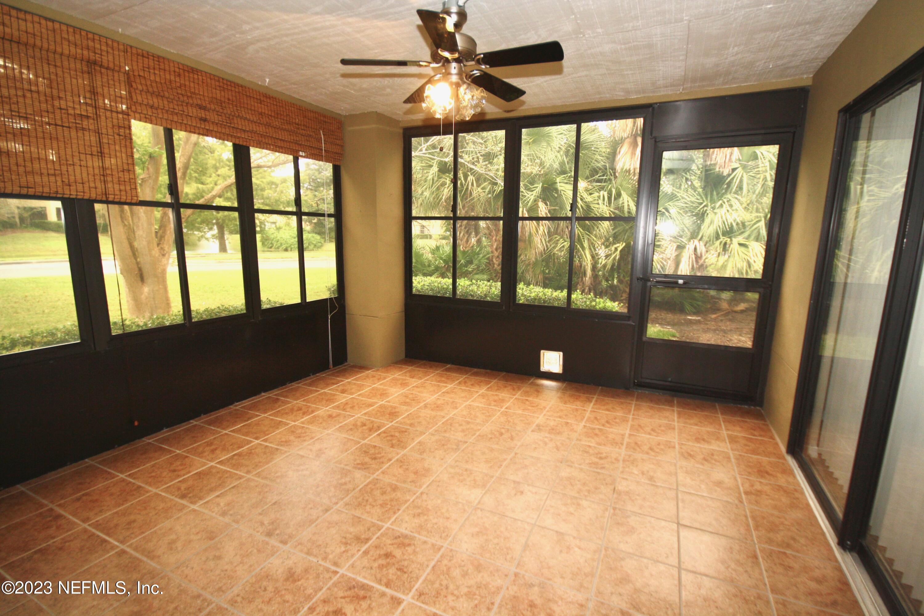 10150 Belle Rive Boulevard, Unit 2303 Jacksonville, FL 32256 - Photo 11 of 28 a view of an empty room with a window