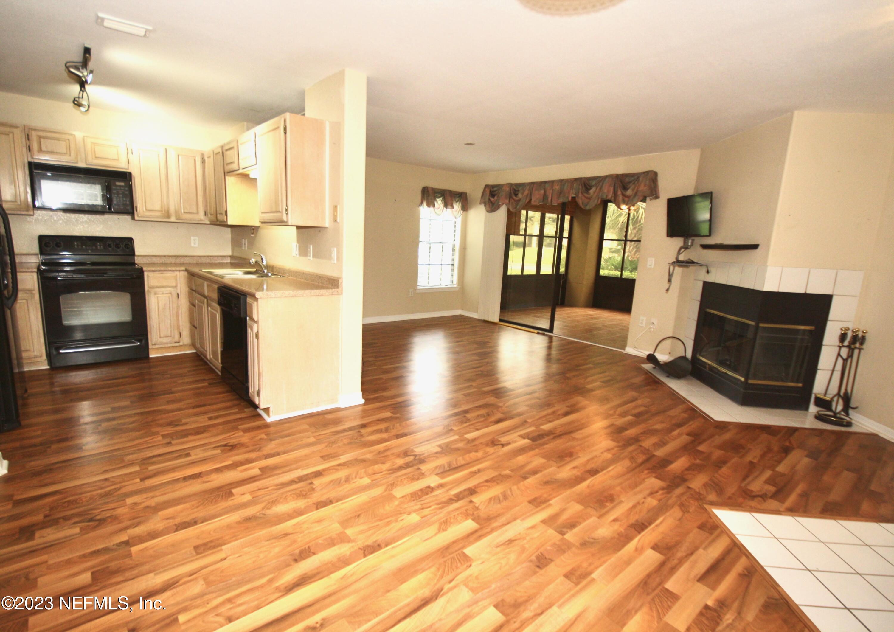 10150 Belle Rive Boulevard, Unit 2303 Jacksonville, FL 32256 - Photo 2 of 28 a view of kitchen with microwave and cabinets