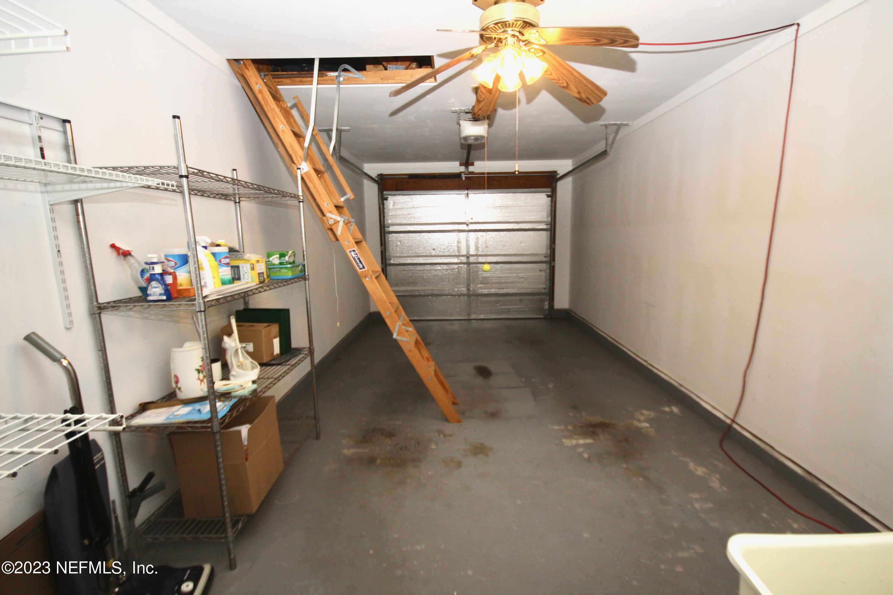 10150 Belle Rive Boulevard, Unit 2303 Jacksonville, FL 32256 - Photo 21 of 28 a view of storage and utility room with stairs