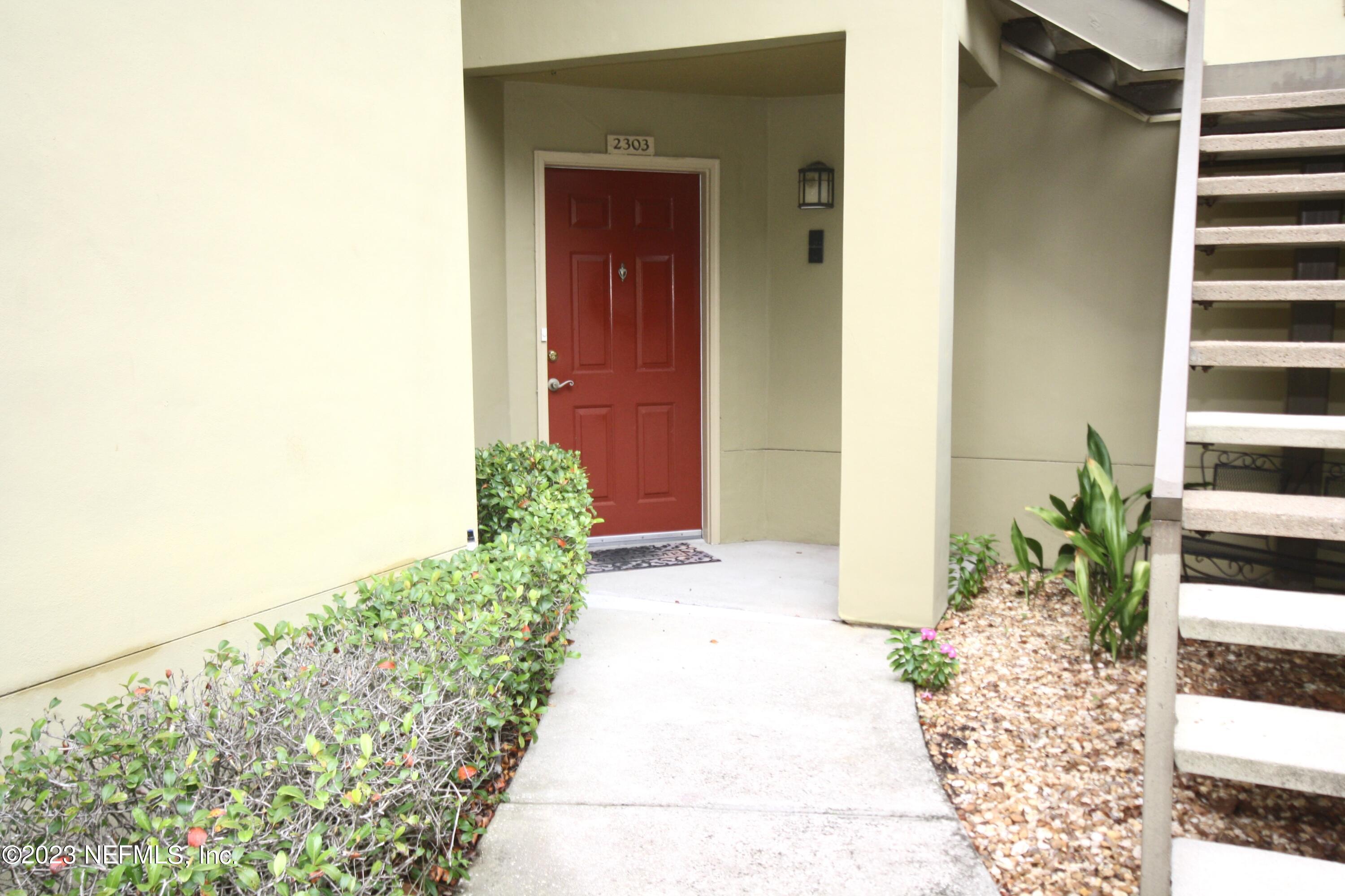 10150 Belle Rive Boulevard, Unit 2303 Jacksonville, FL 32256 - Photo 22 of 28 a view of potted plants with sky view