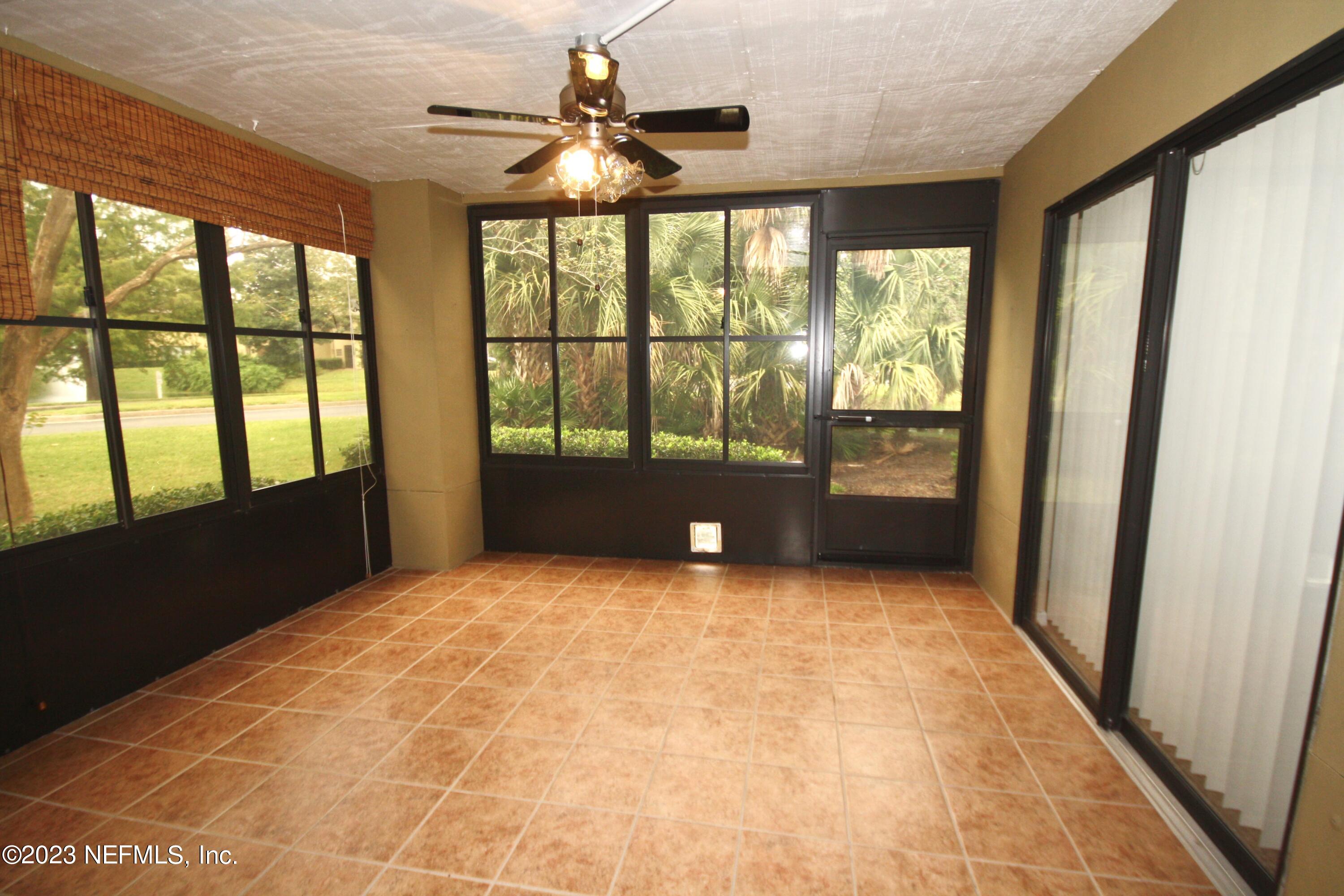 10150 Belle Rive Boulevard, Unit 2303 Jacksonville, FL 32256 - Photo 23 of 28 a view of an empty room with a window