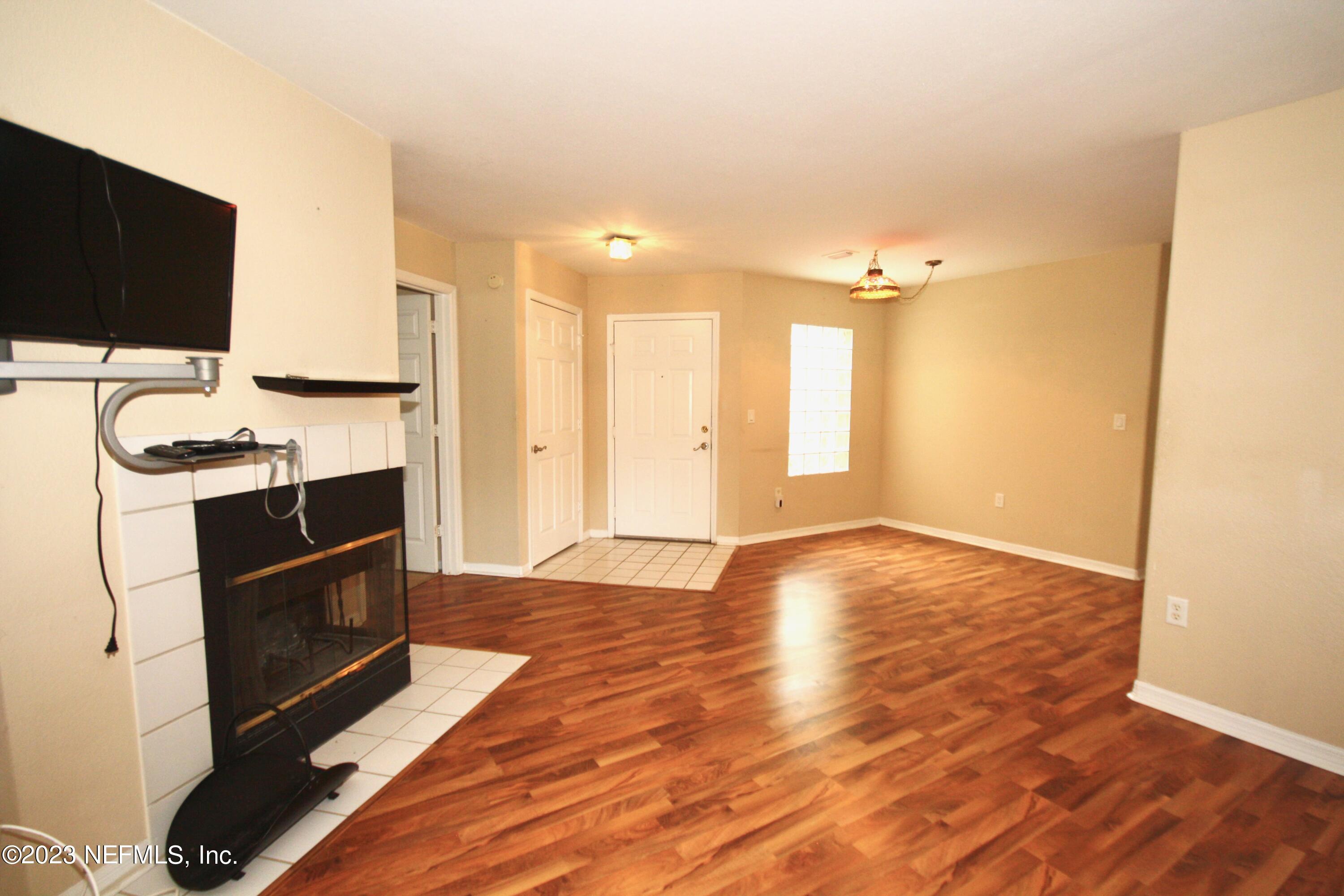 10150 Belle Rive Boulevard, Unit 2303 Jacksonville, FL 32256 - Photo 5 of 28 a view of a kitchen with a sink and a refrigerator