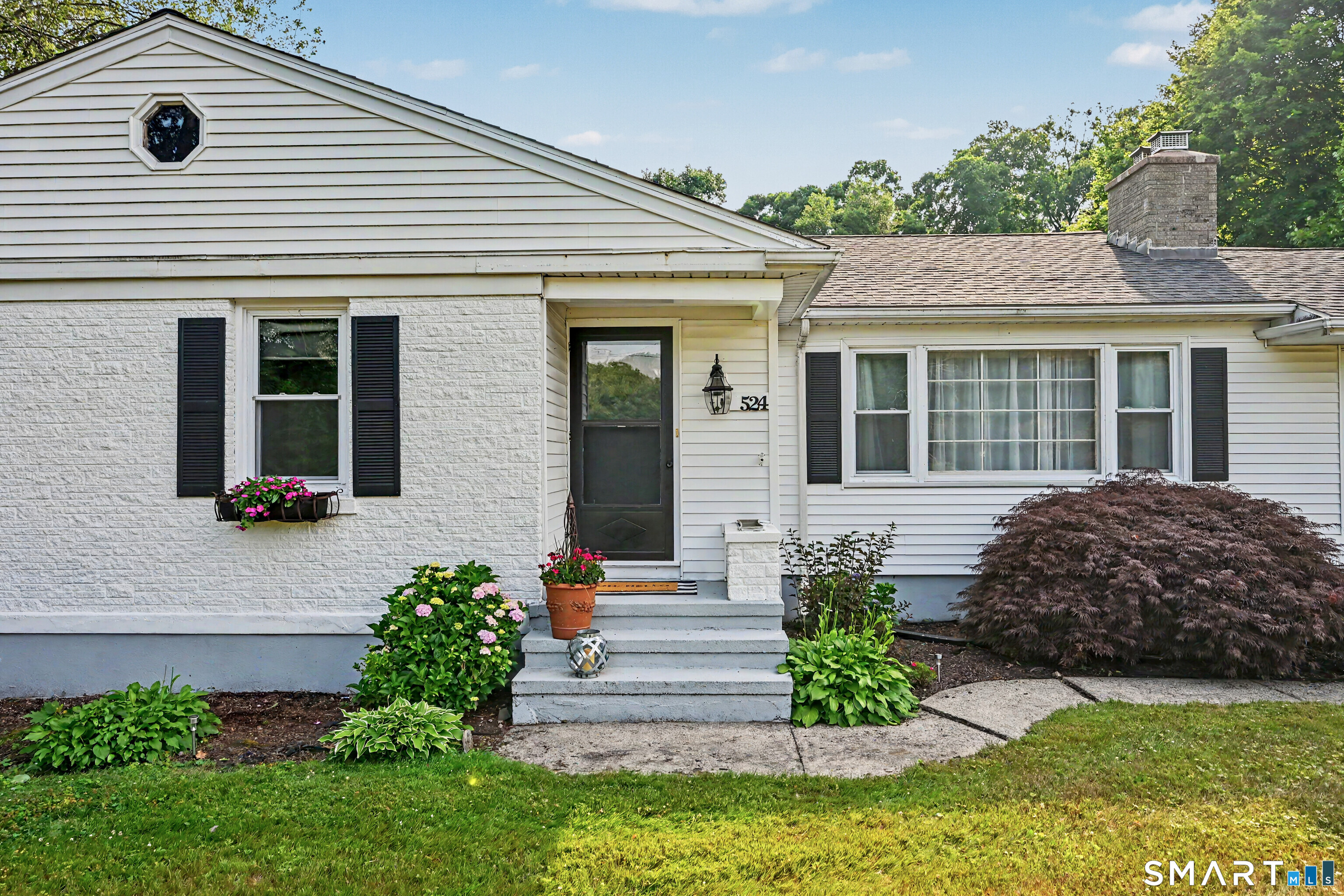 524 Ferry Road Orange, CT 06477 - Photo 4 of 40 a front view of a house with garden