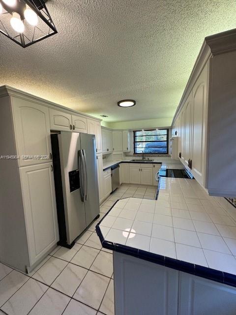 1045 Southwest 122nd Court Miami, FL 33184 - Photo 12 of 44 a view of a kitchen with a sink and refrigerator