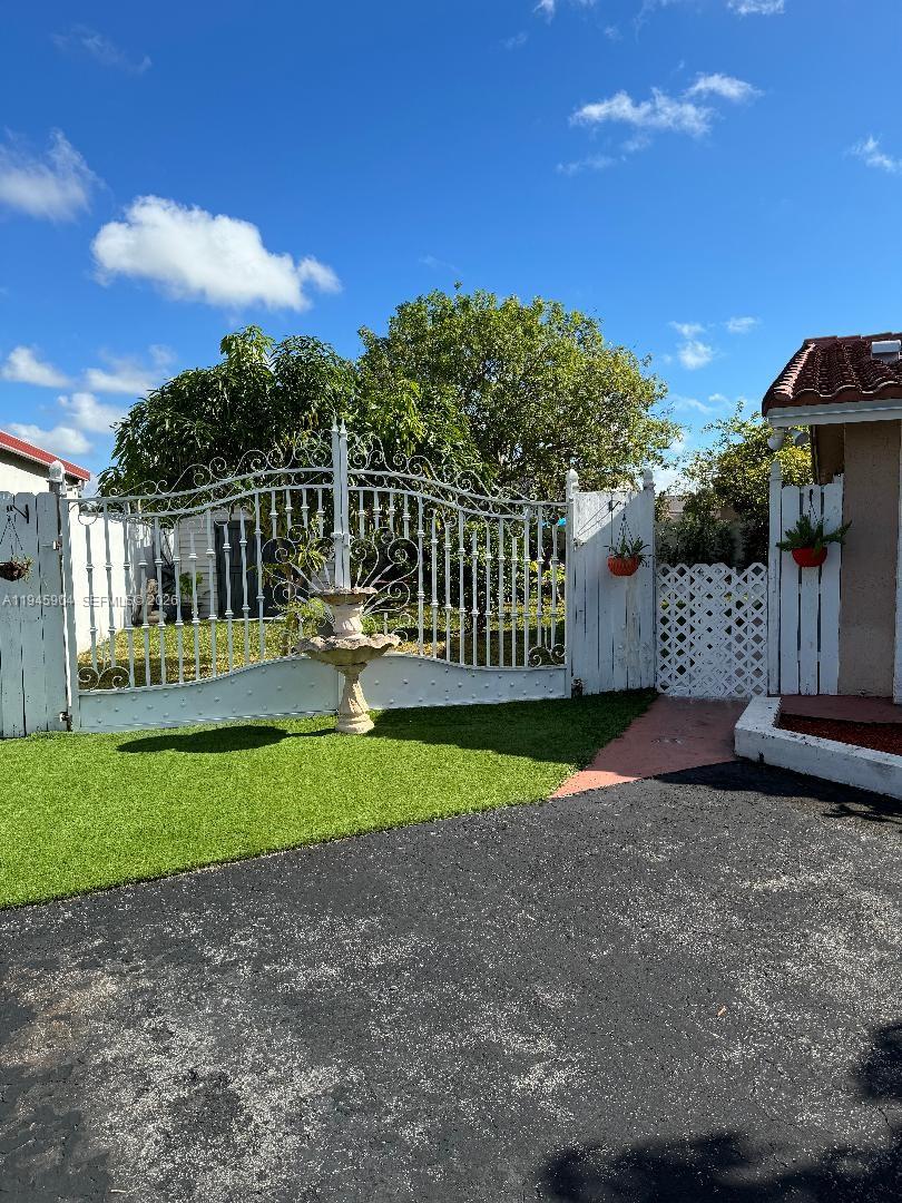 1045 Southwest 122nd Court Miami, FL 33184 - Photo 2 of 44 a view of a park with iron fence