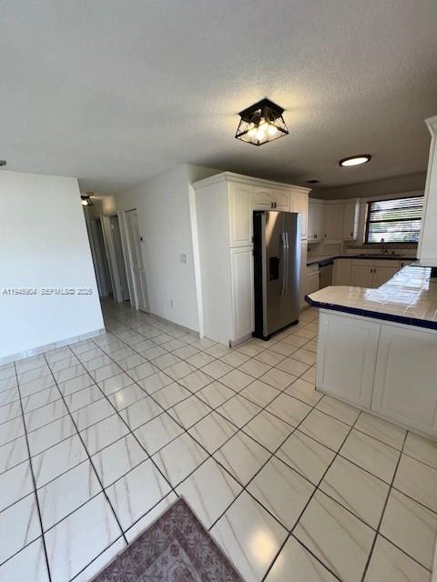 1045 Southwest 122nd Court Miami, FL 33184 - Photo 32 of 44 a view of a refrigerator and window in a room