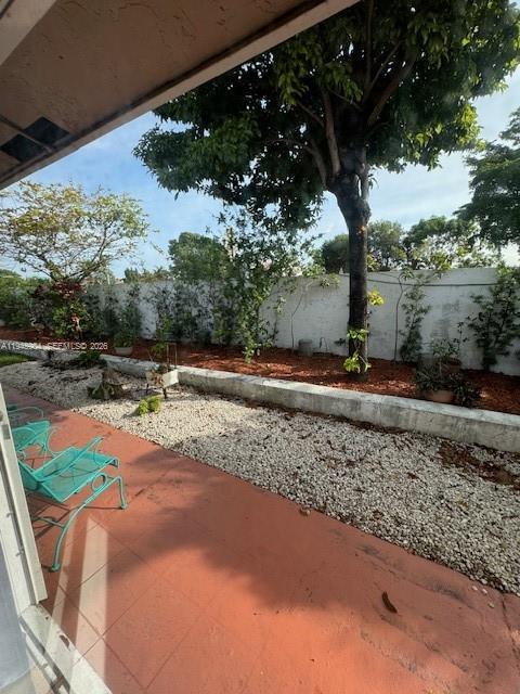 1045 Southwest 122nd Court Miami, FL 33184 - Photo 35 of 44 a view of a backyard with a tree