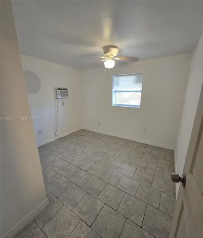 an empty room with a empty space and a window