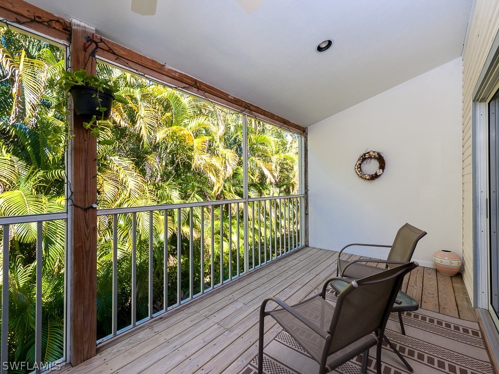 965 Beach Road Sanibel, FL 33957 - Photo 6 of 34 a view of a balcony with furniture and outside view