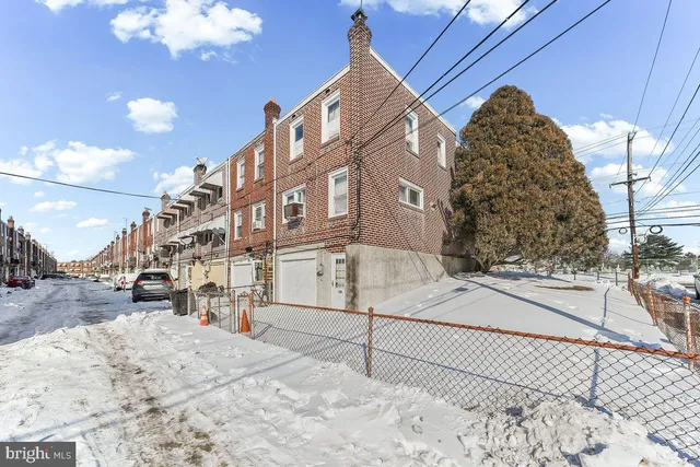 a view of a room with a window and a ceiling fan