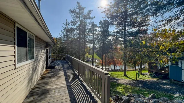 a view of a lake with boats and a bench