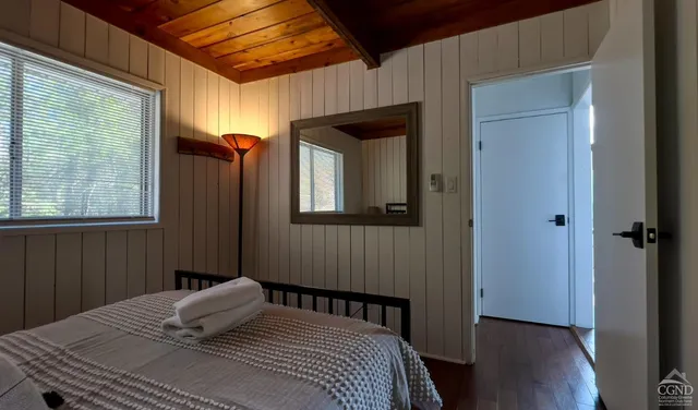 a bedroom with a bed and window
