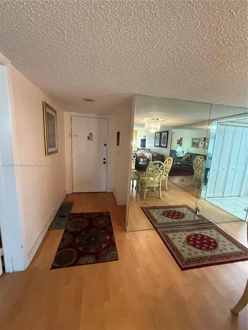 a living room with furniture rug and a window