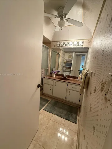 a bathroom with a sink and mirror