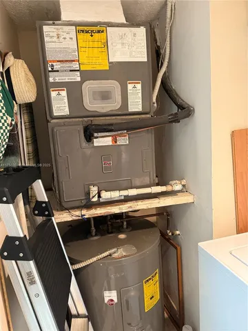 a close view of a sink a stove and a microwave oven on a table