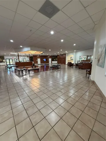 a lobby with furniture and view