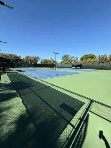 a view of an outdoor space and tennis court