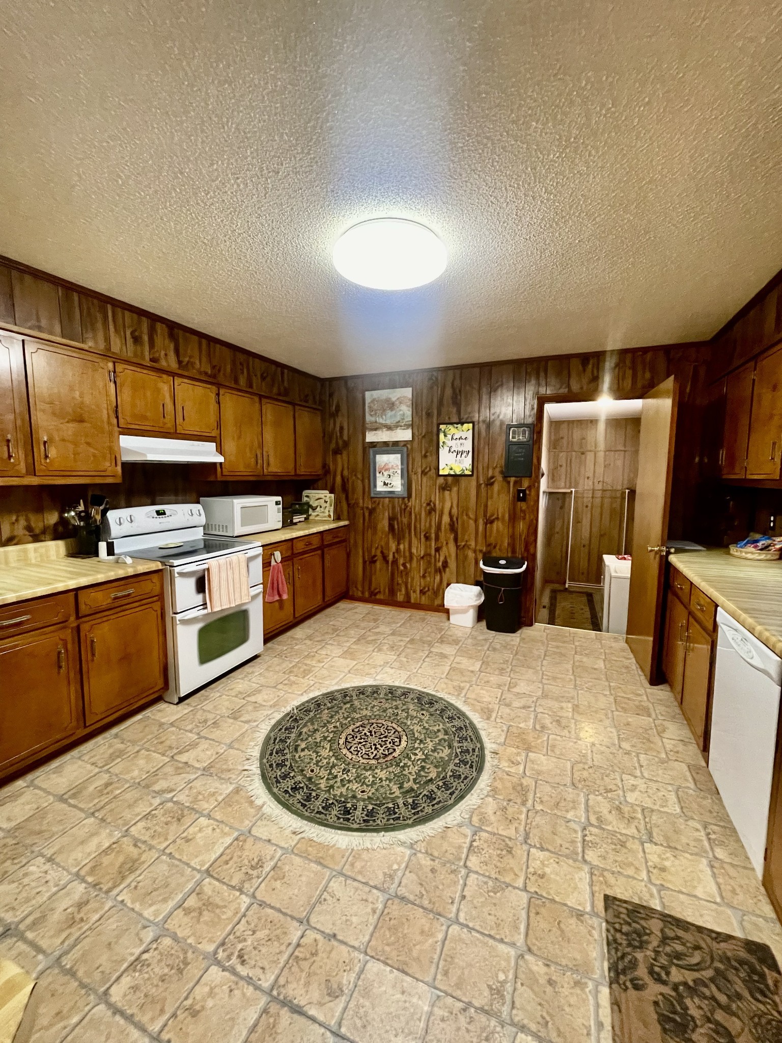 336 Second Creek Road Five Points, TN 38457 - Photo 11 of 37 a kitchen with stainless steel appliances granite countertop a sink stove and refrigerator