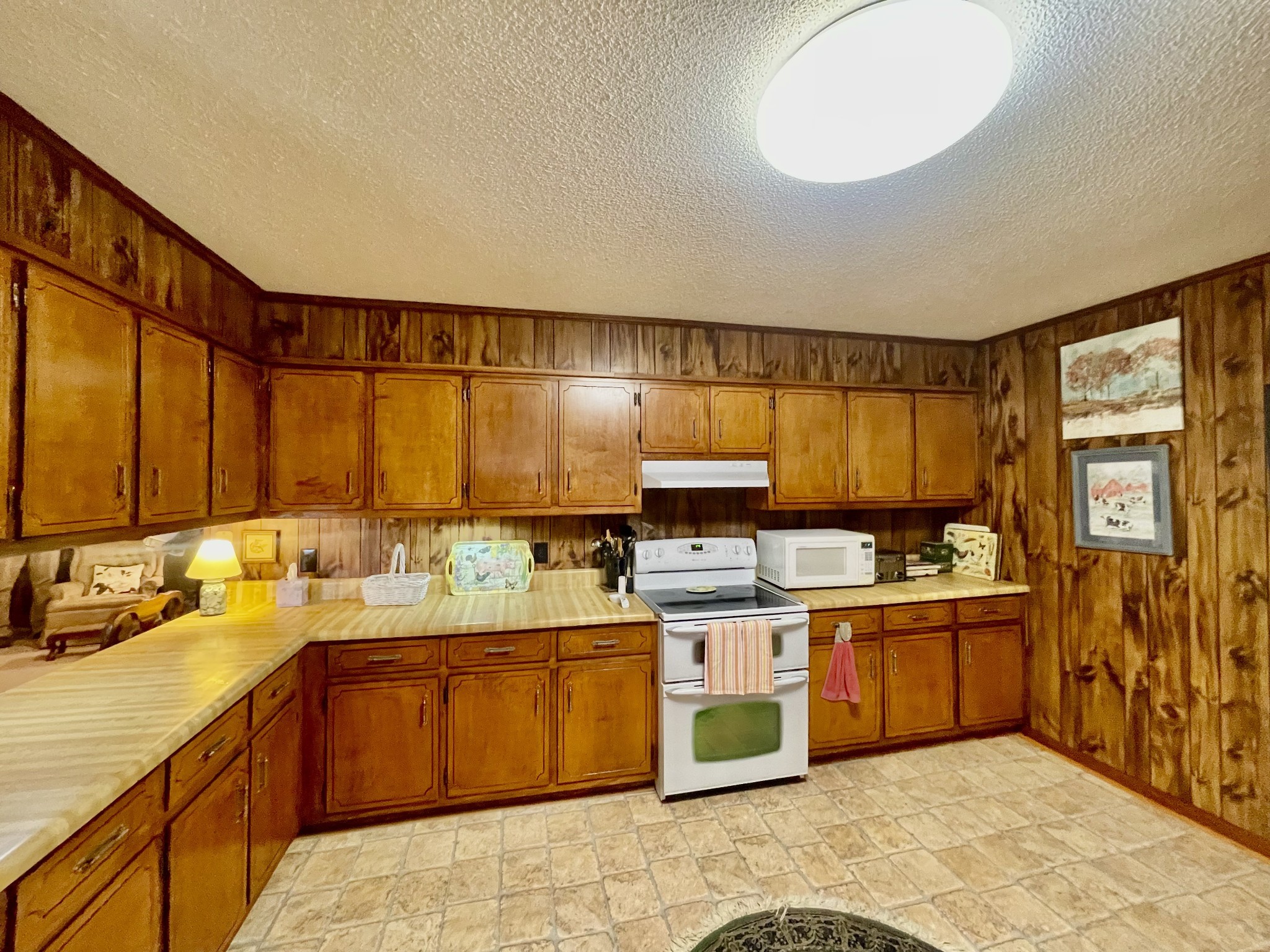 336 Second Creek Road Five Points, TN 38457 - Photo 12 of 37 a kitchen with a sink a stove and cabinets