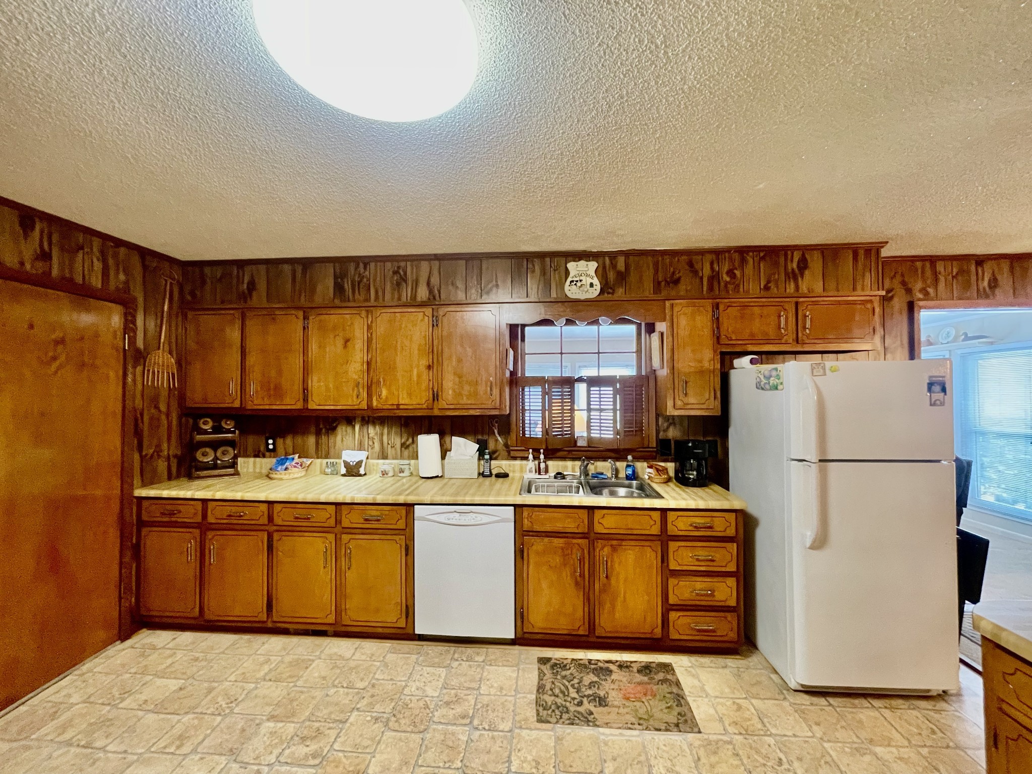336 Second Creek Road Five Points, TN 38457 - Photo 15 of 37 a kitchen with a refrigerator a stove top oven a sink and dishwasher