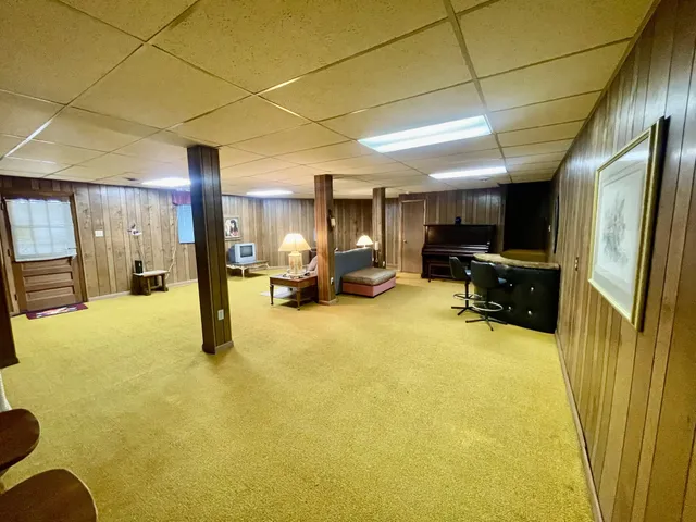 a view of living room with furniture stove and refrigerator