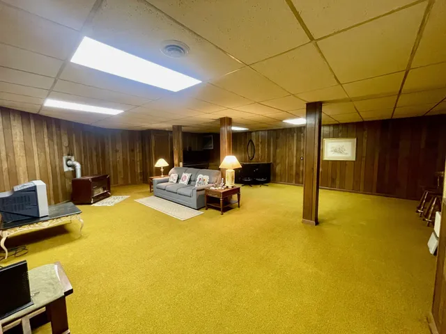 a view of a big room with furniture and a table kitchen