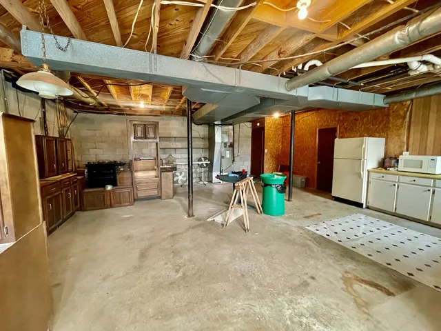 a view of a room with wooden furniture