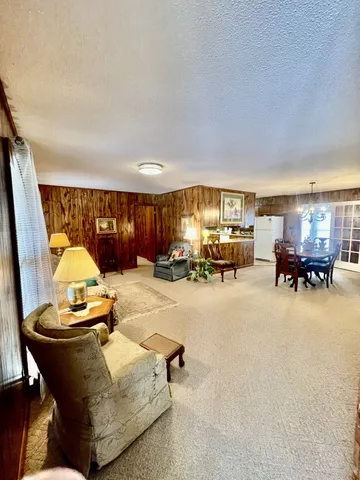 a living room with furniture and a table