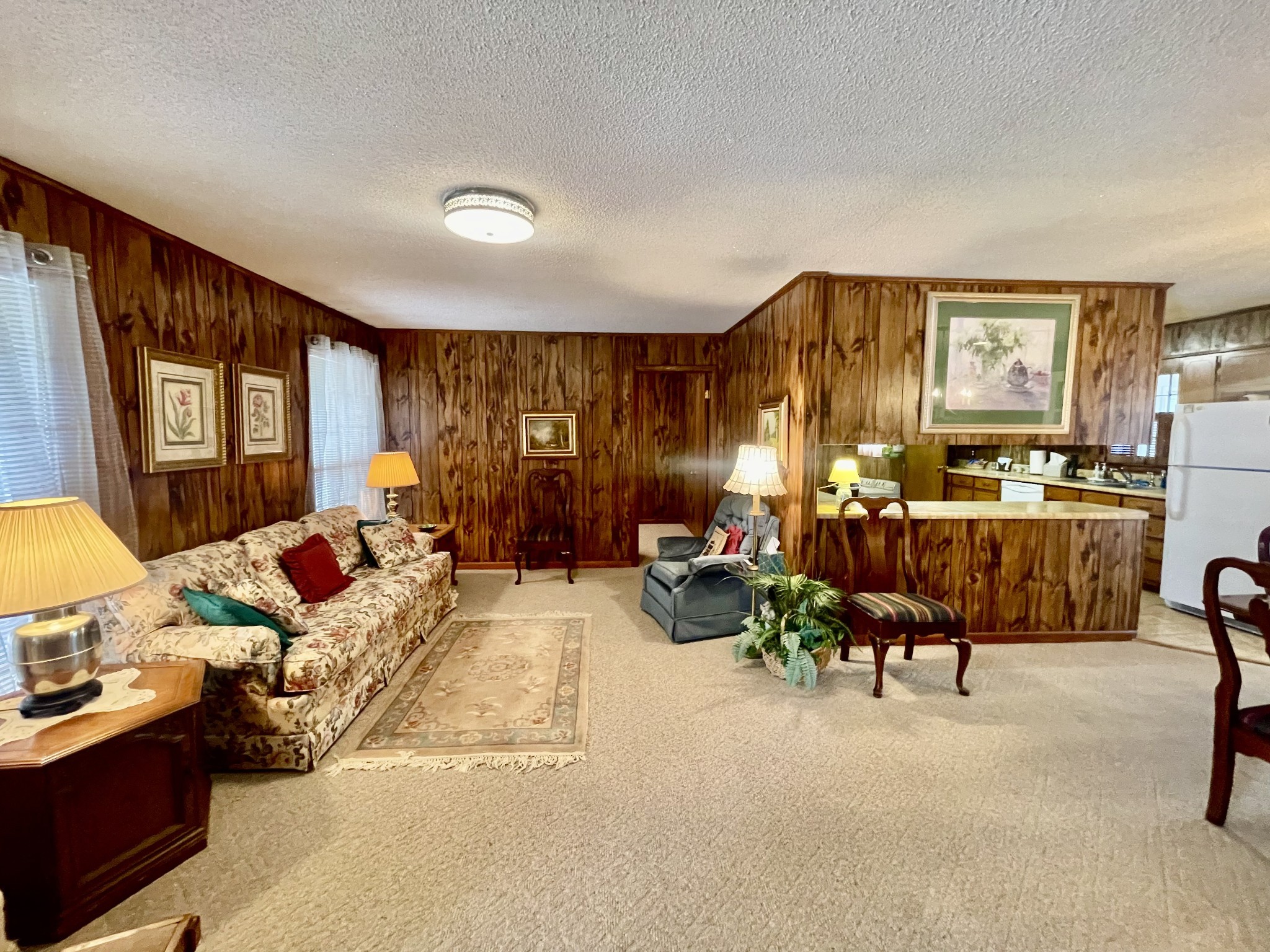336 Second Creek Road Five Points, TN 38457 - Photo 8 of 37 a living room with furniture kitchen view and a large window
