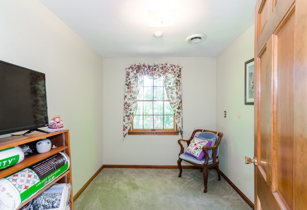 60 Birch Meadow Road Merrimac, MA 01860 - Photo 19 of 27 a living room with furniture and a flat screen tv