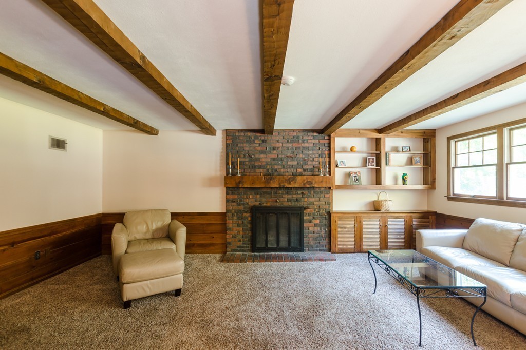 60 Birch Meadow Road Merrimac, MA 01860 - Photo 6 of 27 a living room with furniture and a fireplace
