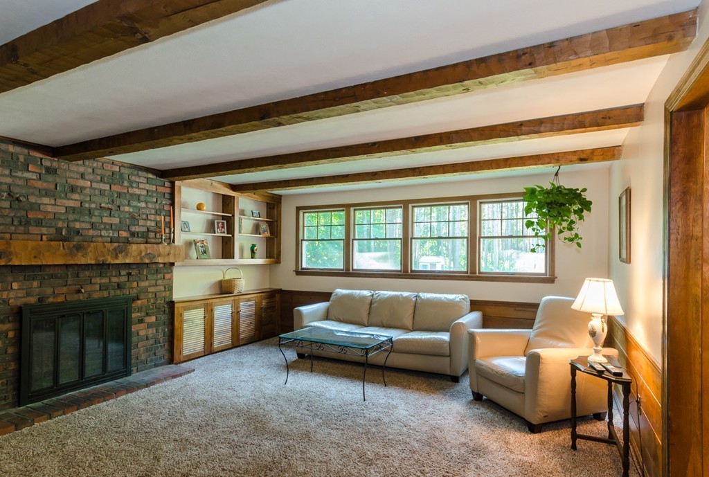 60 Birch Meadow Road Merrimac, MA 01860 - Photo 7 of 27 a living room with furniture and a fireplace