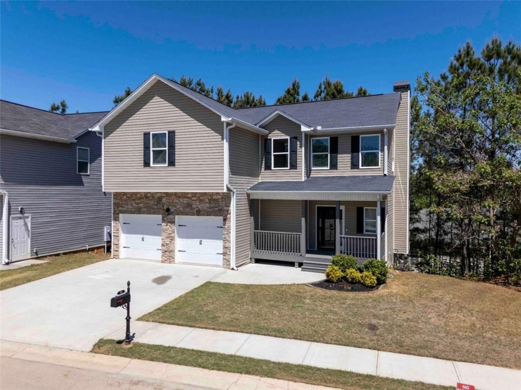 68 Crescent Commons Drive Dallas, GA 30157 - Photo 1 of 26 a front view of a house with garden