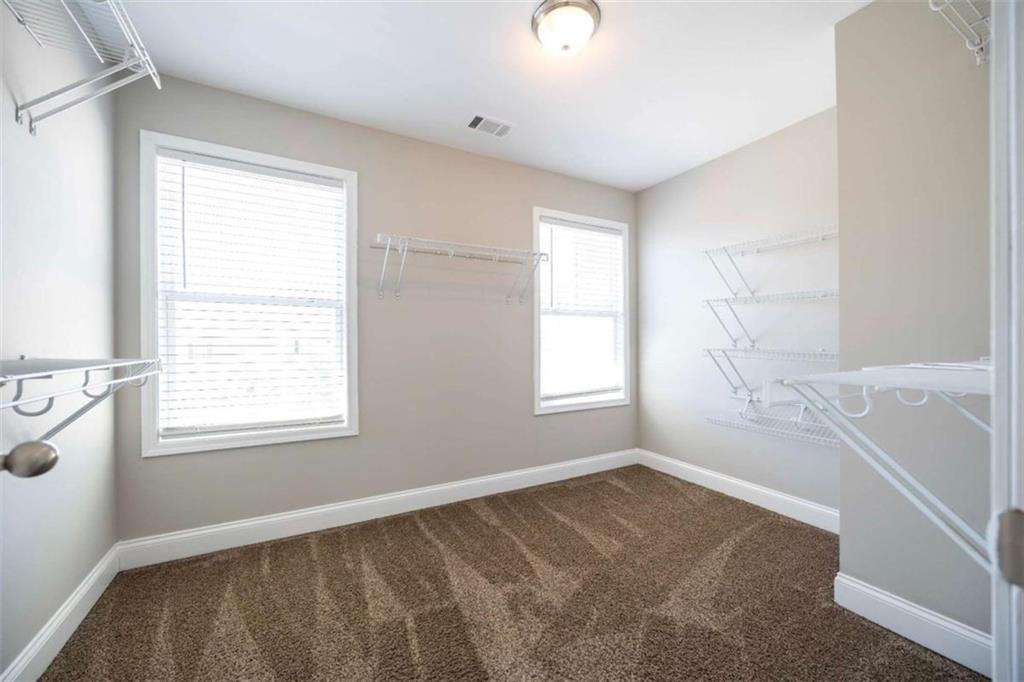 68 Crescent Commons Drive Dallas, GA 30157 - Photo 12 of 26 a view of an empty room and a window