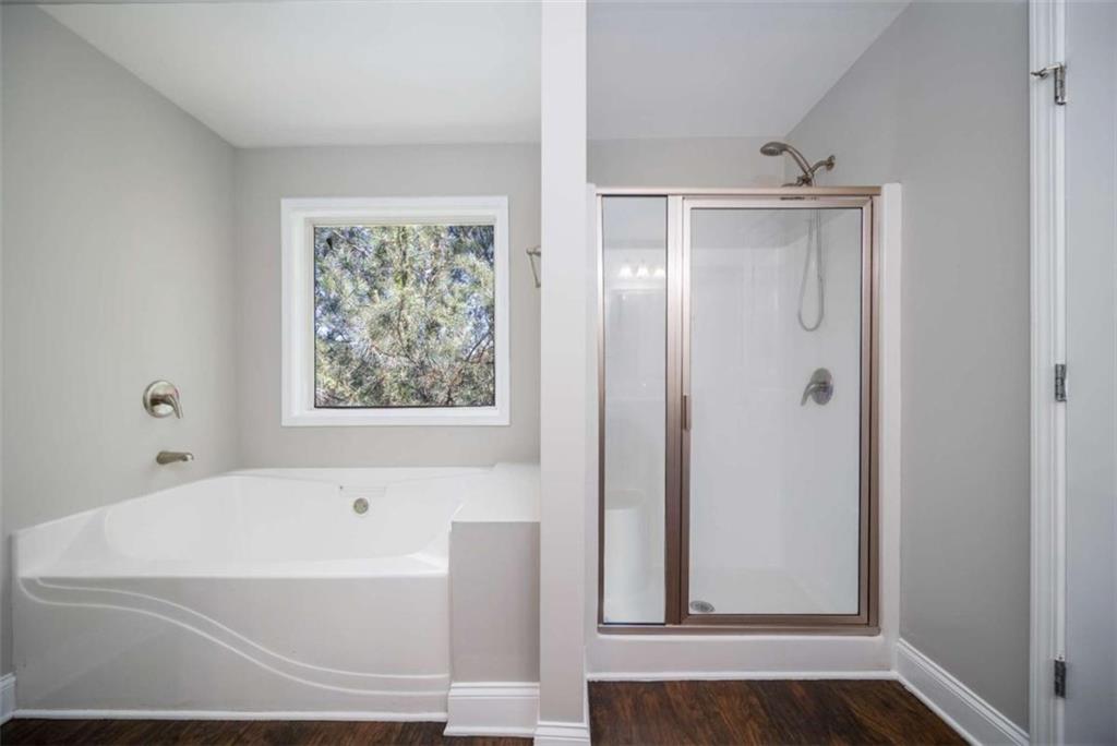 68 Crescent Commons Drive Dallas, GA 30157 - Photo 18 of 26 a bathroom with bathtub and window